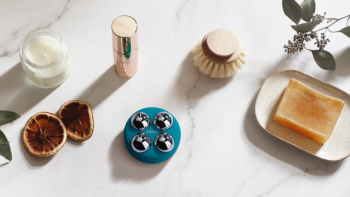 BEAR 2 body best microcurrent device for body on gorgeous bathroom tiles with natural body brushes and shampoos